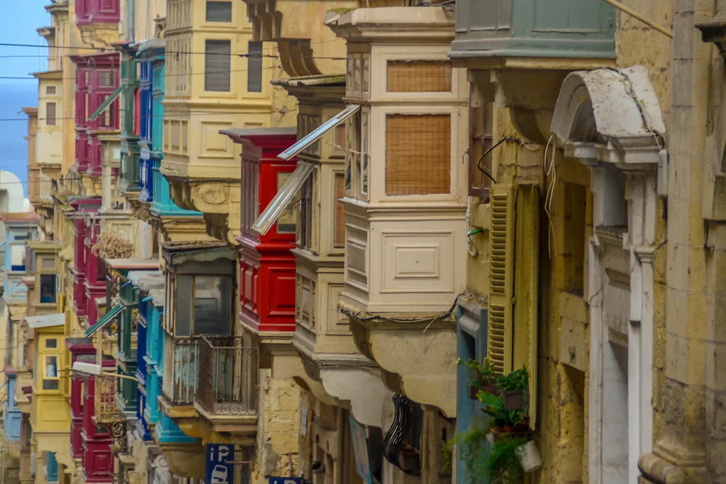 Traditional wooden balconies on a Valletta street.