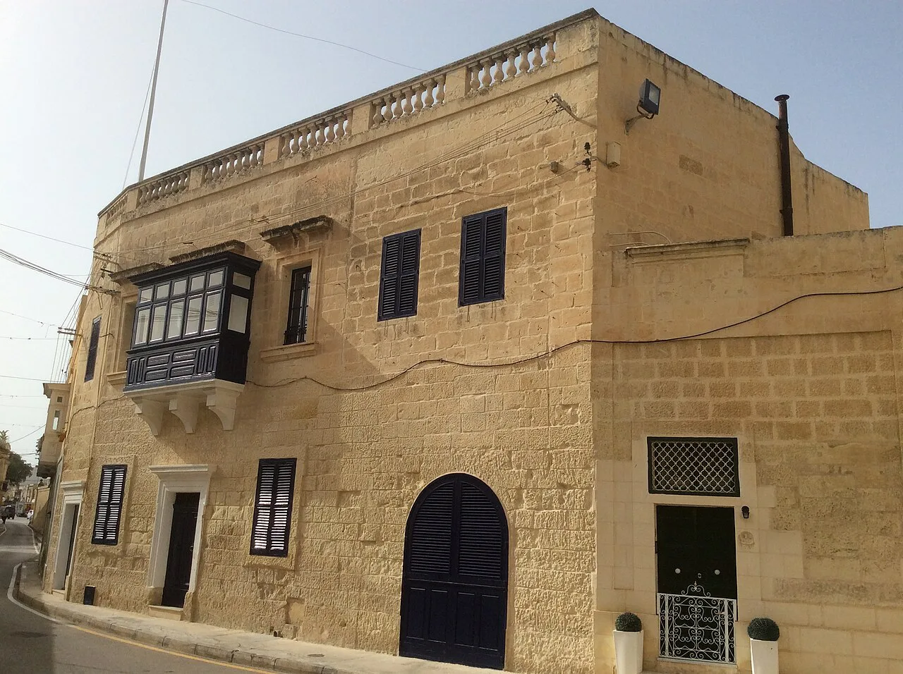 A traditional townhouse with a wooden balcony in Attard.