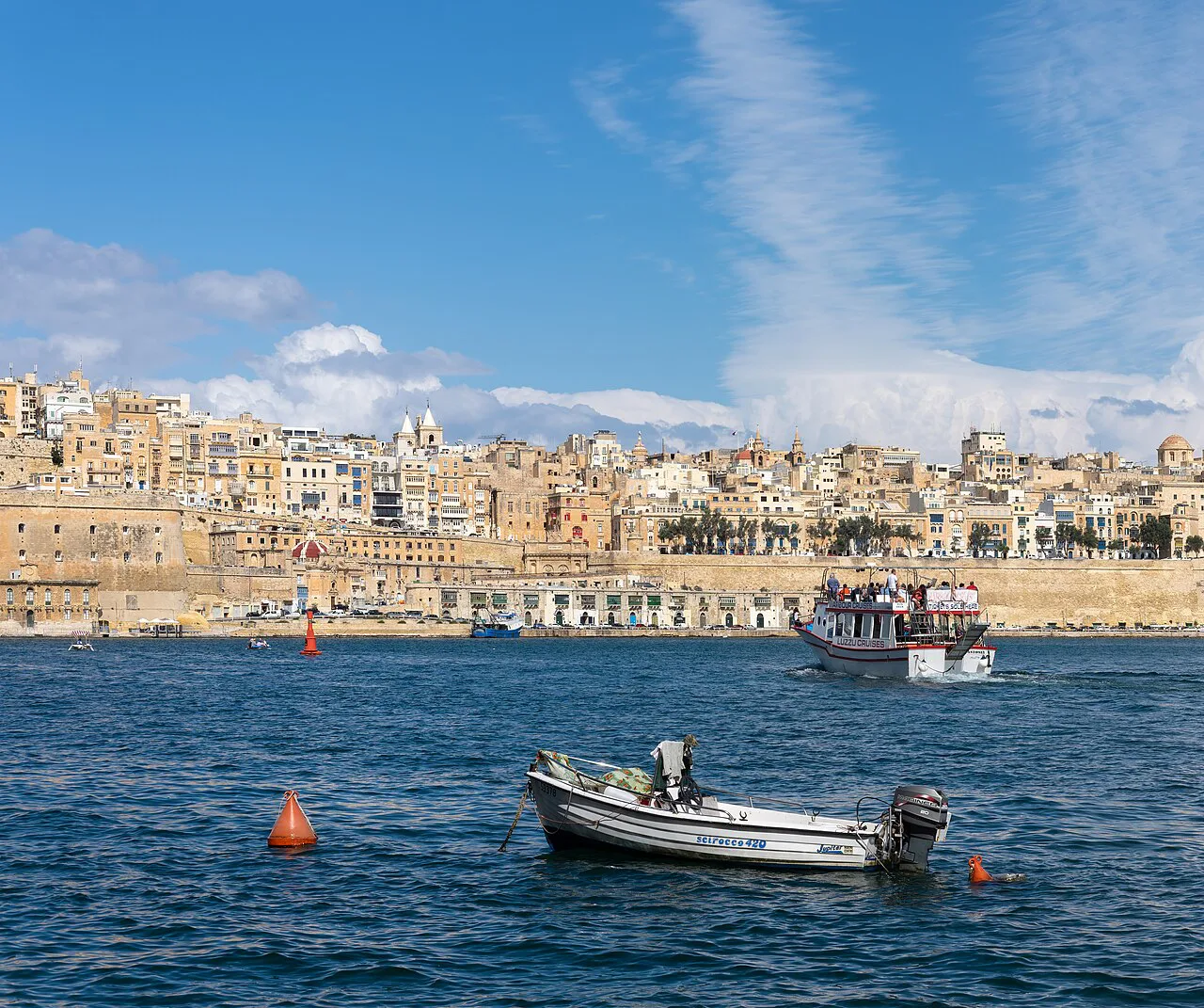Boats off Senglea with Valletta in the background.