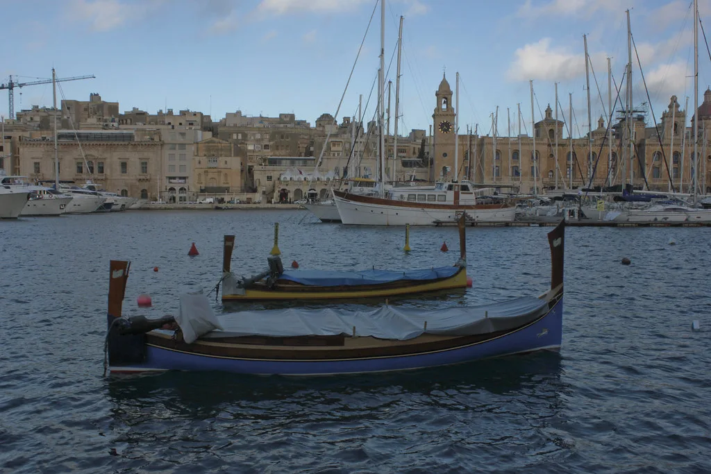 A traditional boat moored in the Grand Harbour near Birgu and Senglea.