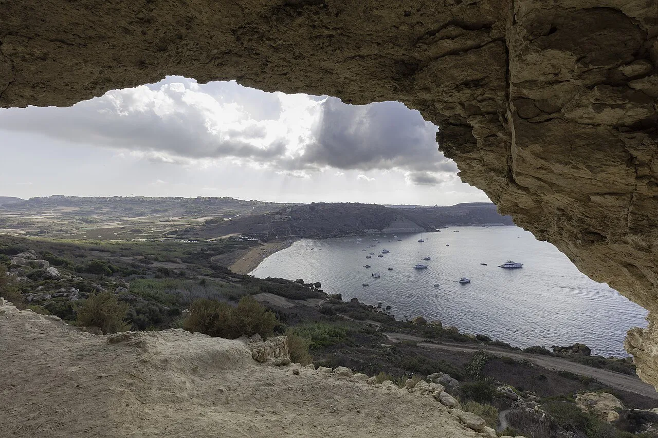 Ramla Bay seen through the opening of Calypso's Cave, Gozo.