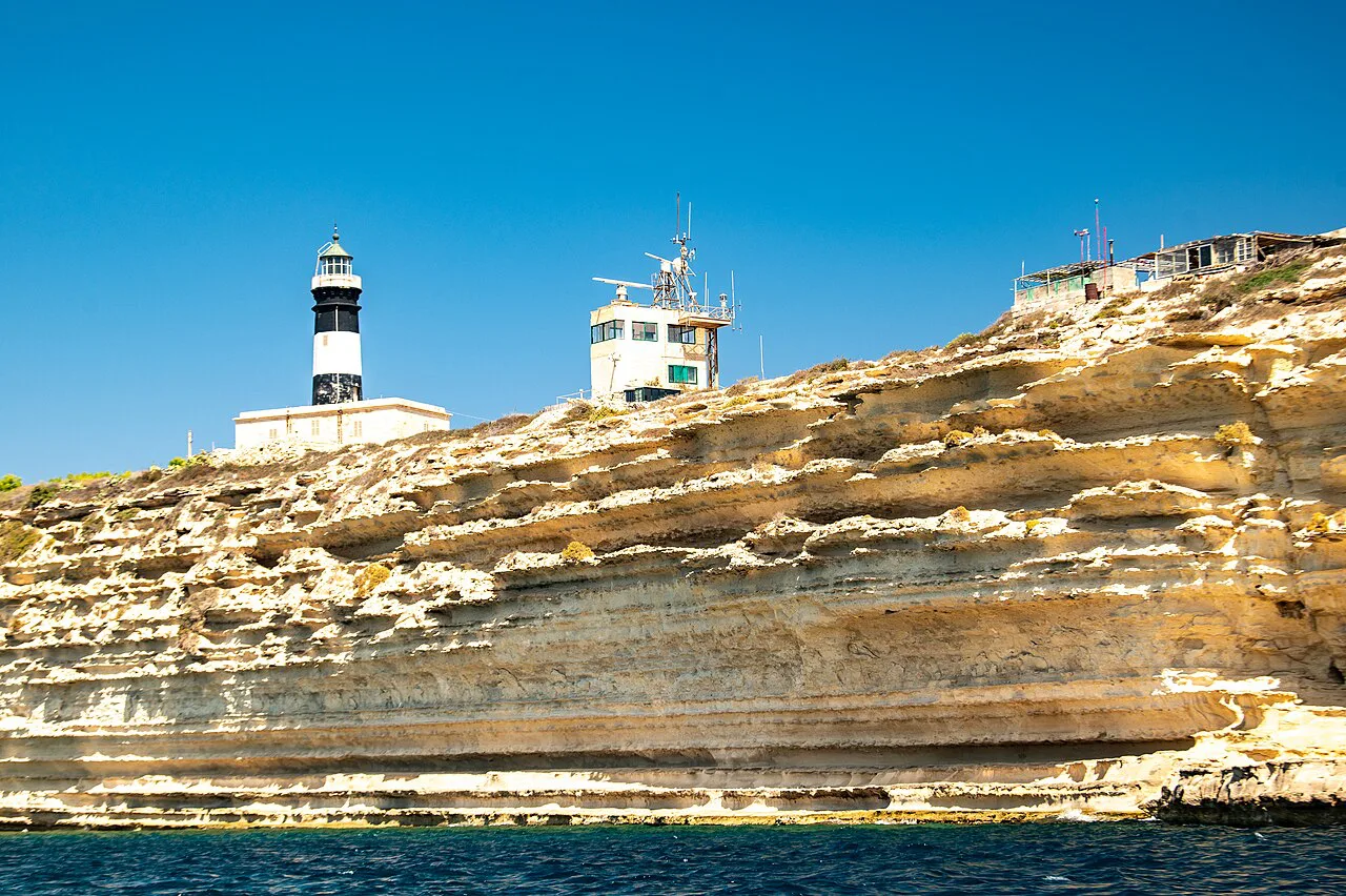 Delimara Lighthouse above the limestone cliffs.