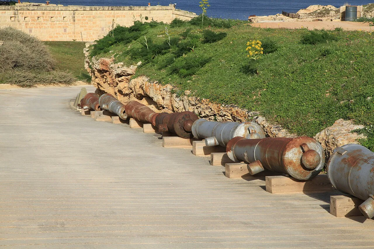 Old cannons beside a path at Fort Rinella in Kalkara.