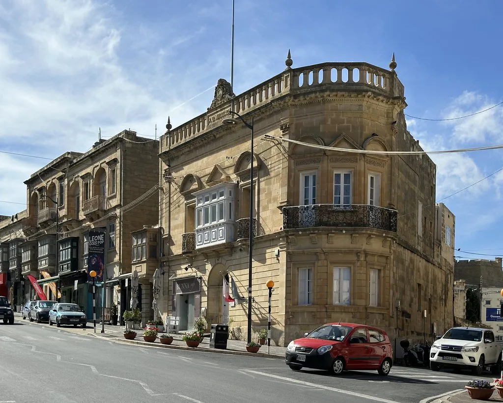 A historic corner building on Republic Street in Victoria, Gozo.