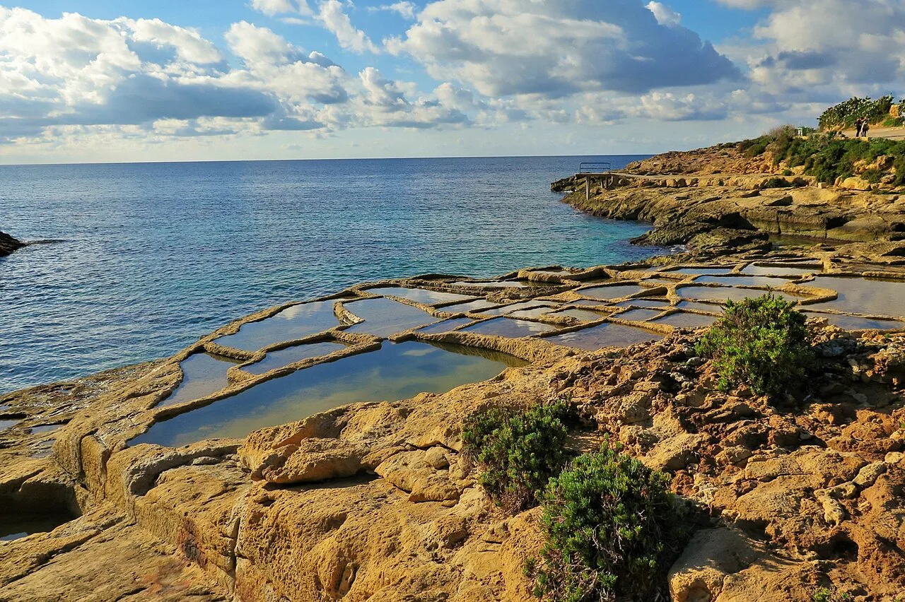Rock-cut salt pans beside the sea on Gozo.