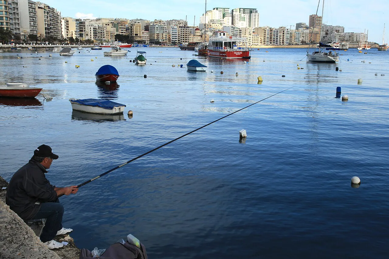 Fishing from the Gżira waterfront on Marsamxett Harbour.