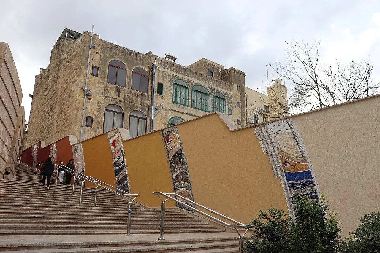 A staircase and painted wall in Victoria, Gozo.