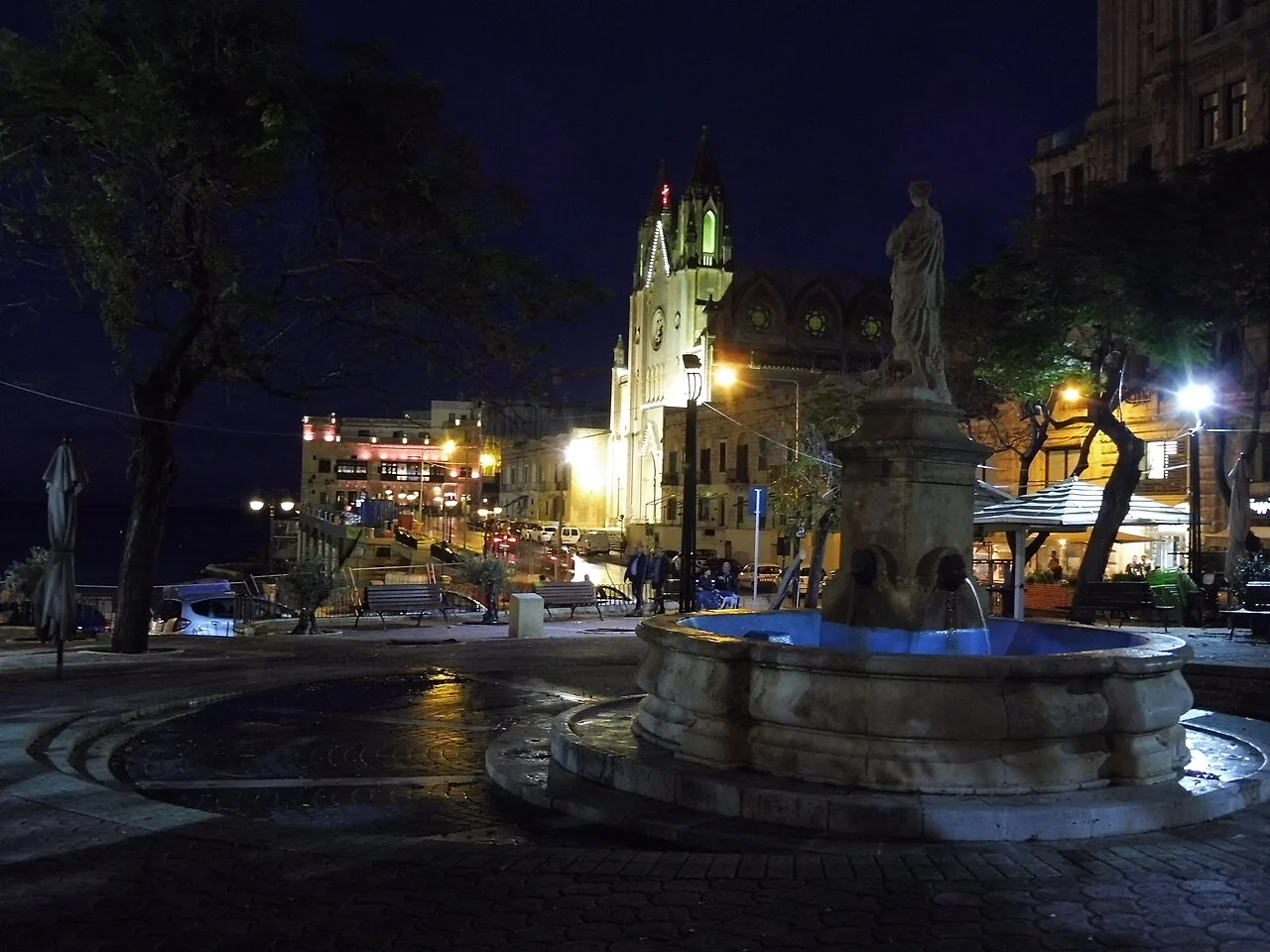 Balluta Square and its church in St Julian's at night.