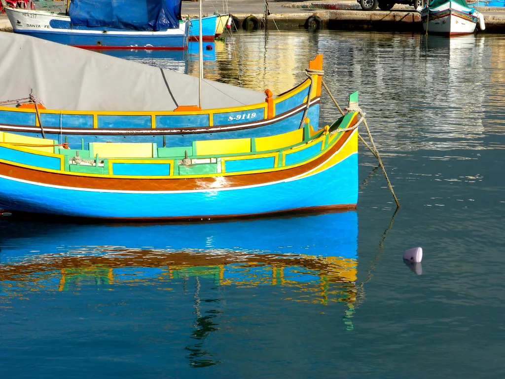 A colourful luzzu moored in Marsaxlokk.