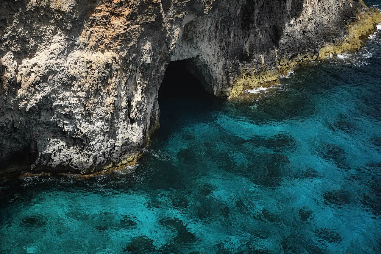 Turquoise water in the sea caves of Comino.