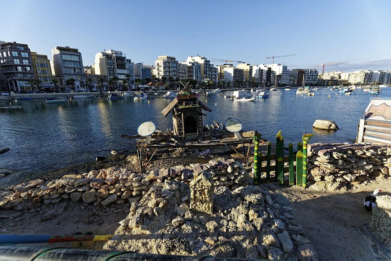 Manoel Island seen across the water, with Gżira's waterfront beyond.
