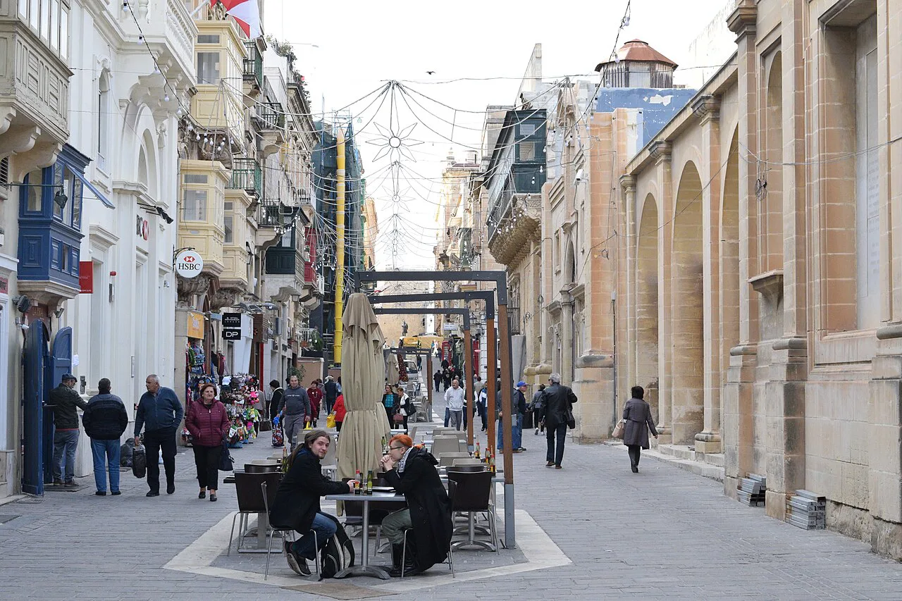Café tables on Triq il-Merkanti in Valletta.