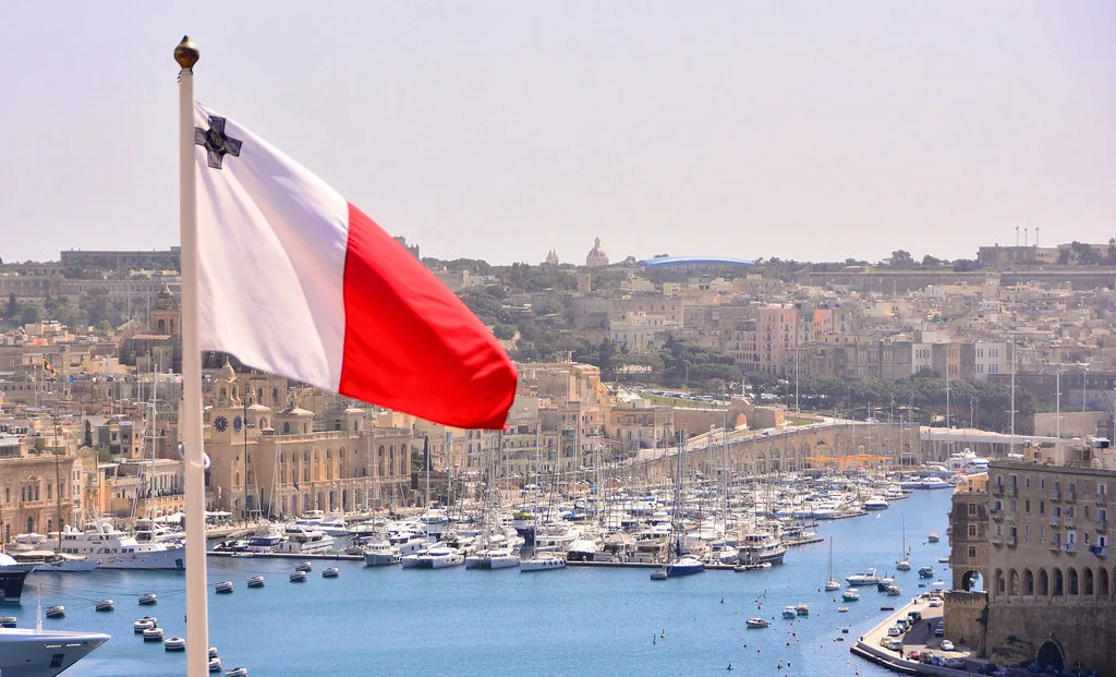 The Maltese flag flying above Valletta's harbour.