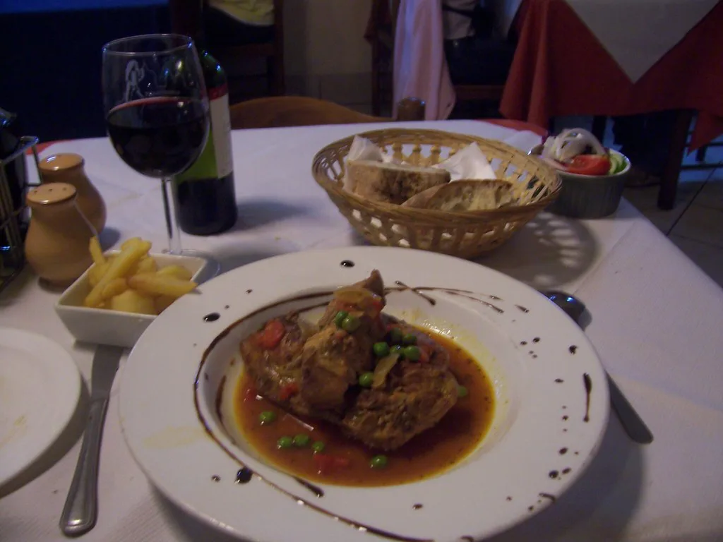 A plate of rabbit stew served in a Maltese restaurant.
