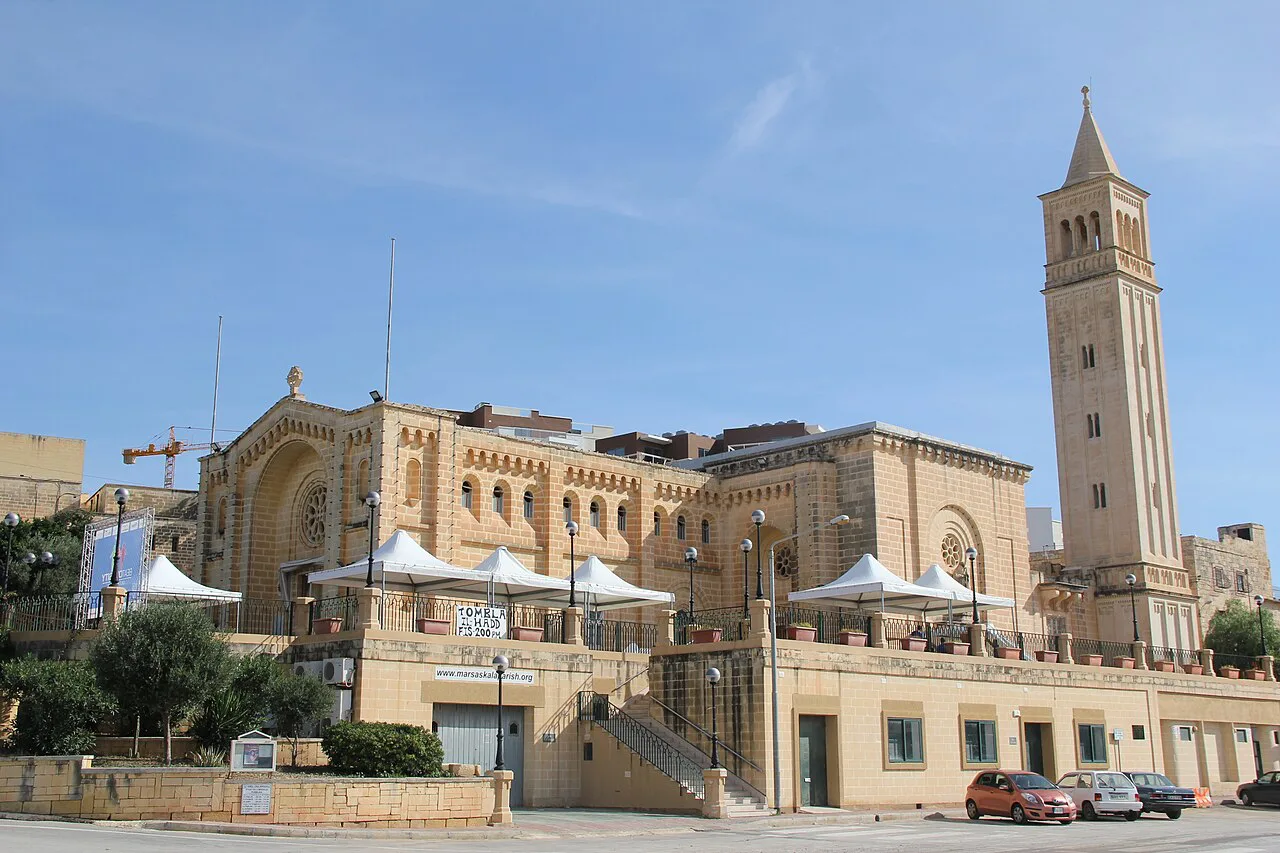 The parish church and bell tower on the seafront at Marsaskala.