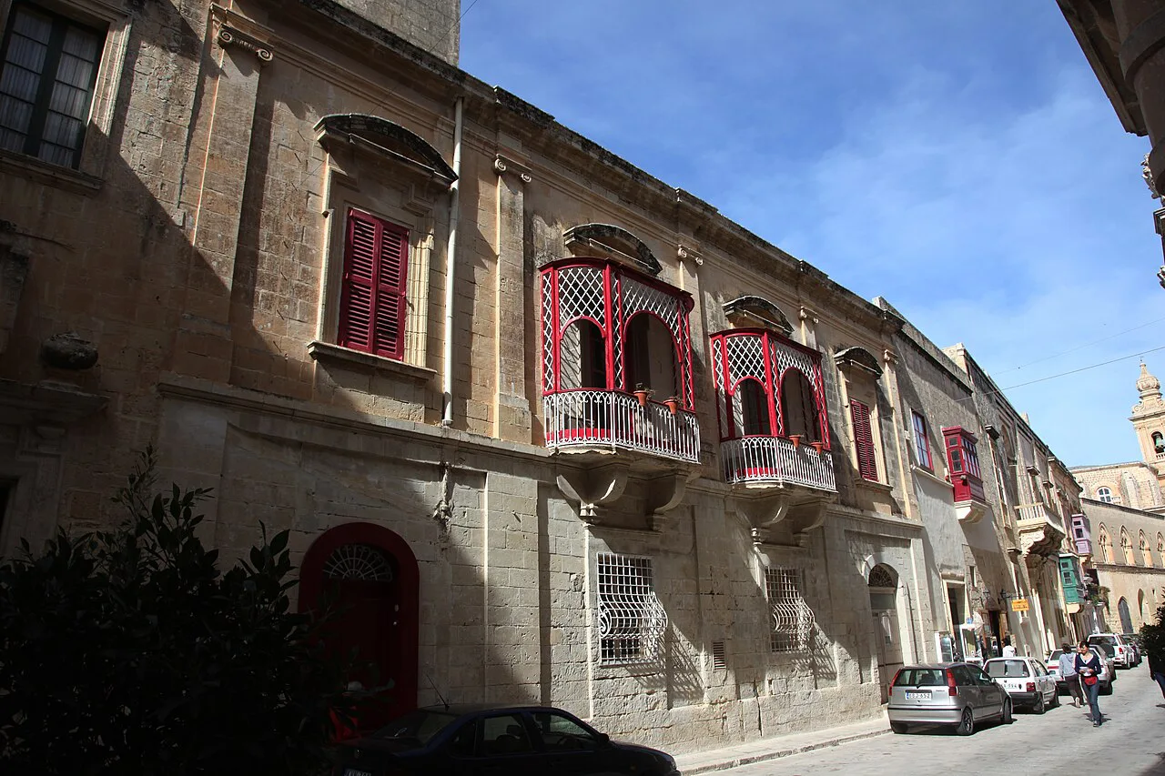 Balconied townhouses along Villegaignon Street in Mdina.