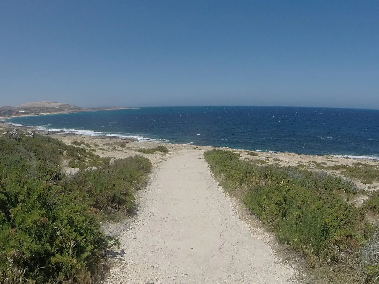 A coastal path at Pembroke leading towards the sea.