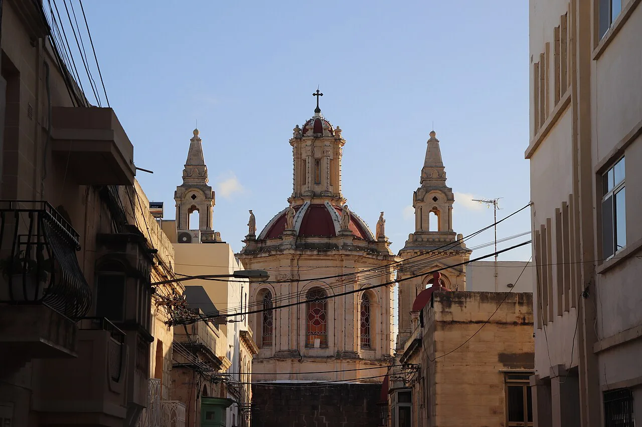 The domes and towers of the Sacro Cuor church above Sliema's streets.
