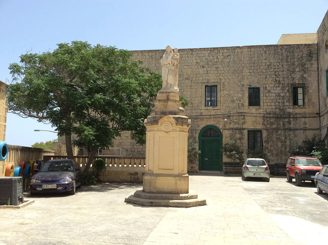 A statue in a quiet square in Victoria, Gozo.