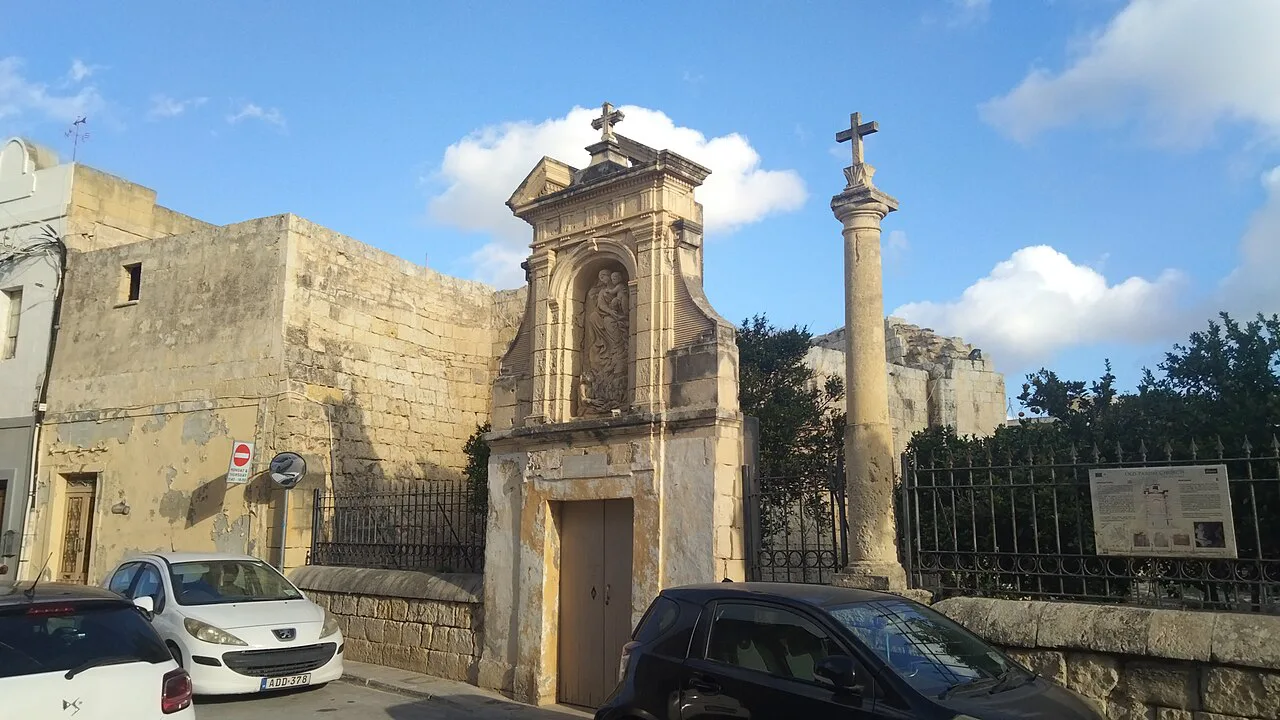 A chapel gateway and column in Siġġiewi.