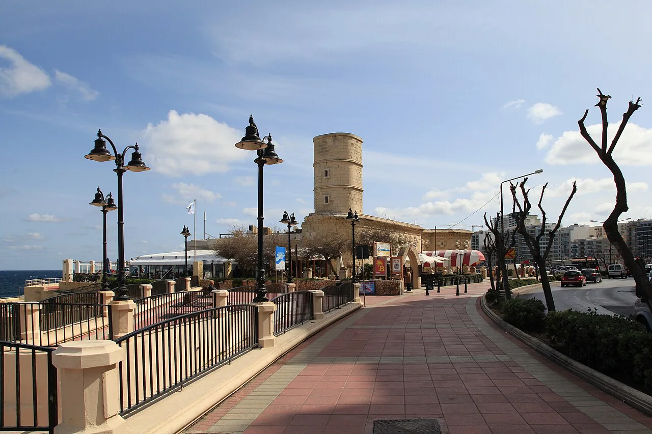 Lamp-lined walkway towards the Fortizza at Sliema Point.