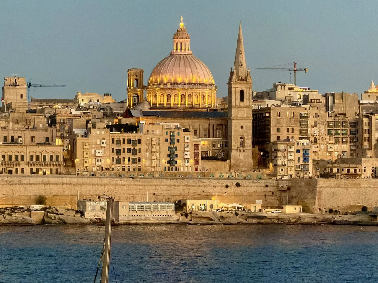 Valletta's skyline seen from Sliema at blue hour.