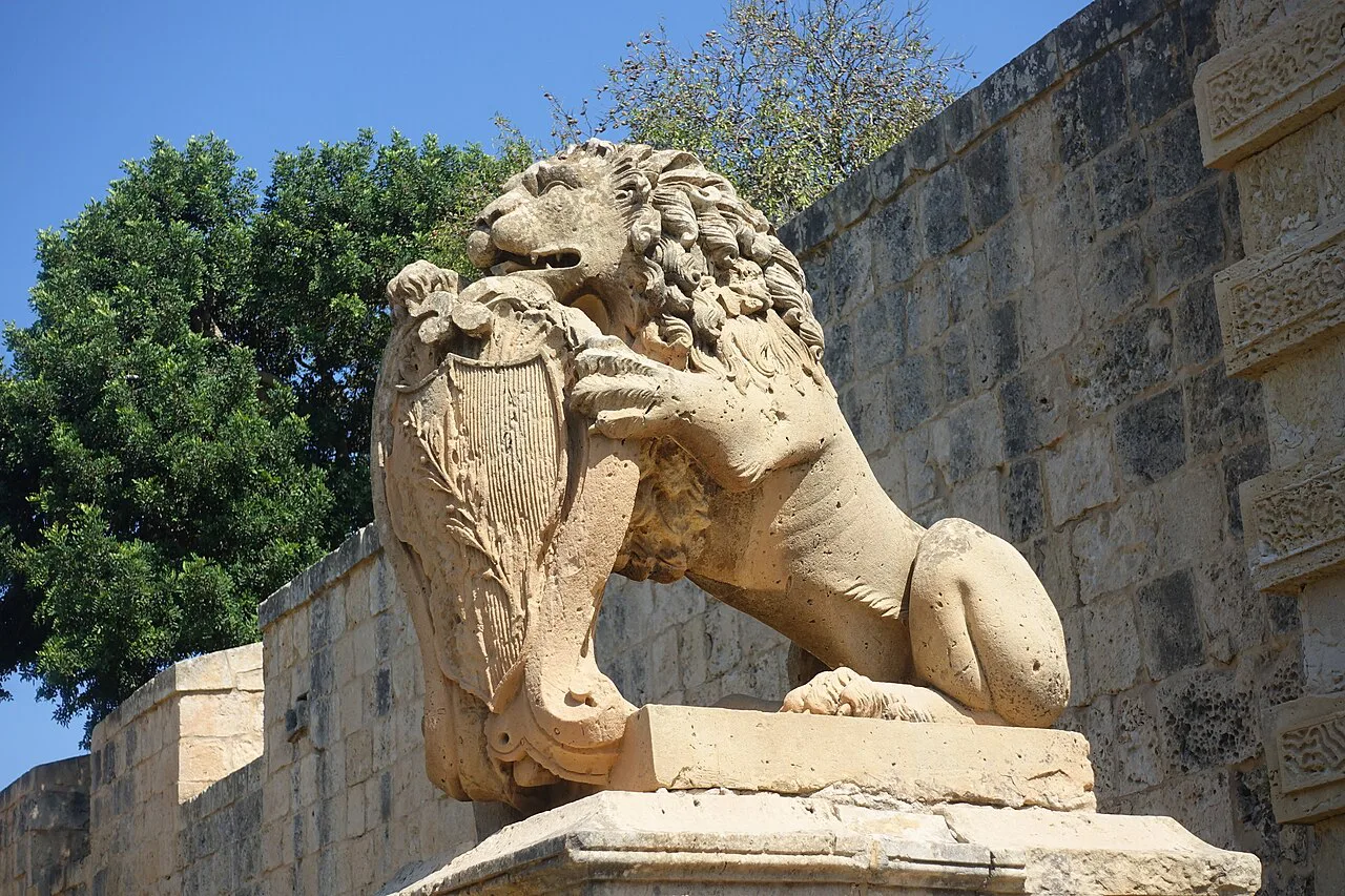 A stone lion at Mdina's Main Gate.