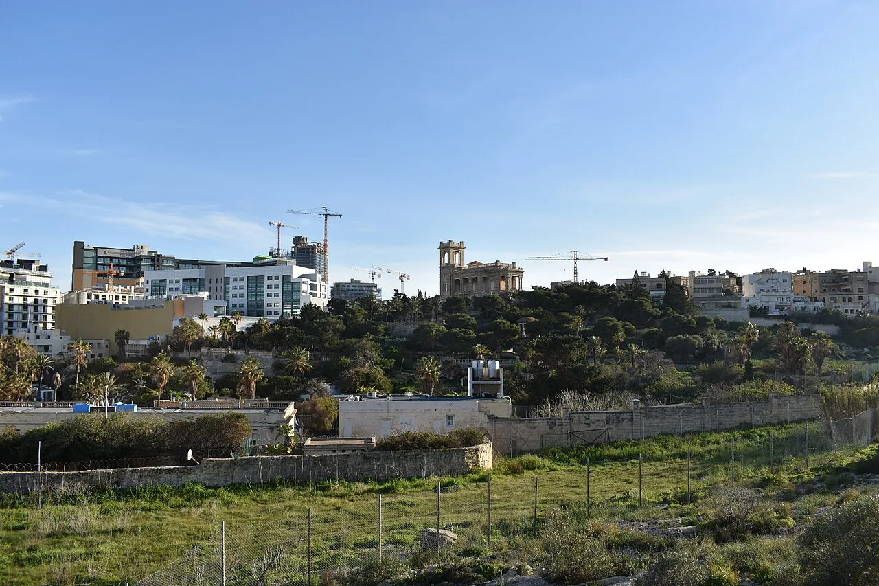 Open land and rooftops at Swieqi.