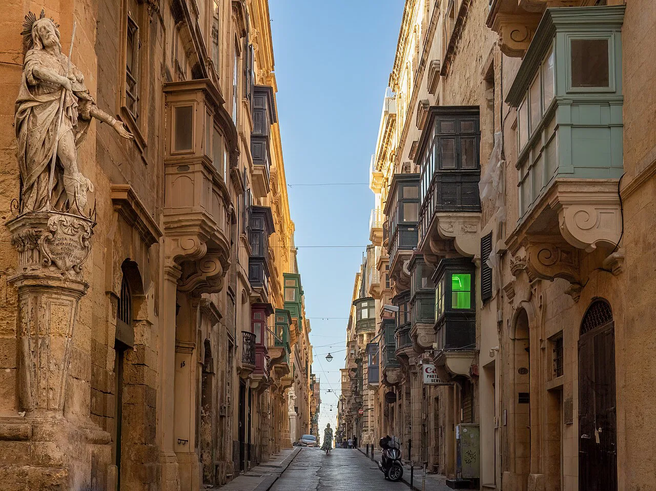 Saint Christopher Street in Valletta, lined with limestone balconies.