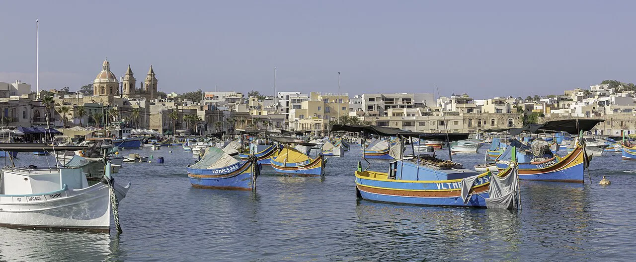 Colourful fishing boats on the water at Marsaxlokk.