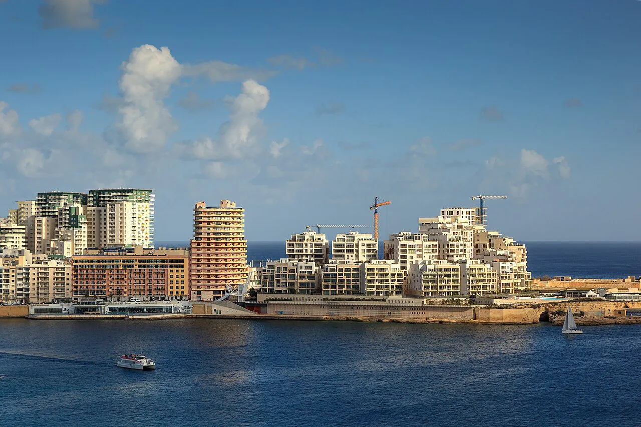 Sliema's waterfront buildings seen across the water.