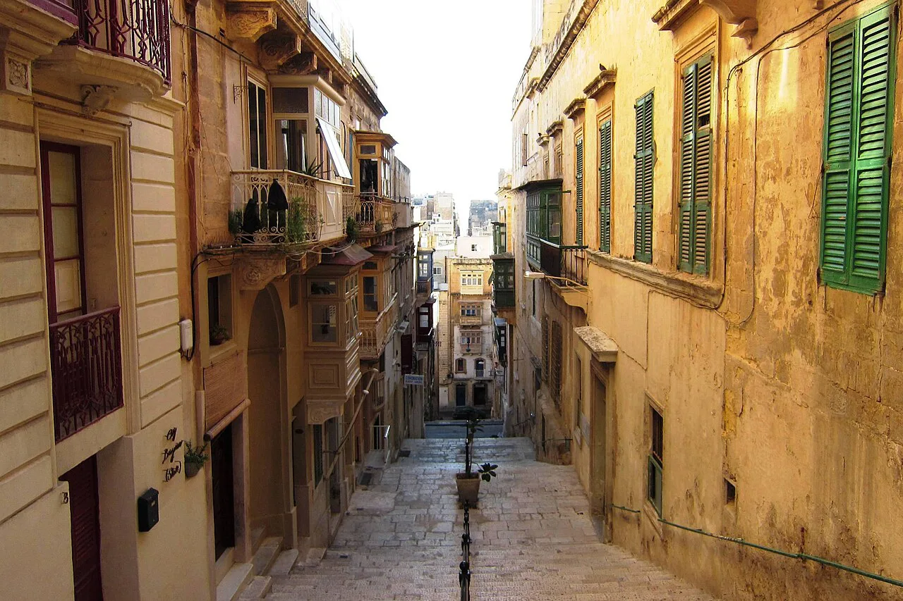 A stepped lane in Valletta lined with balconies.