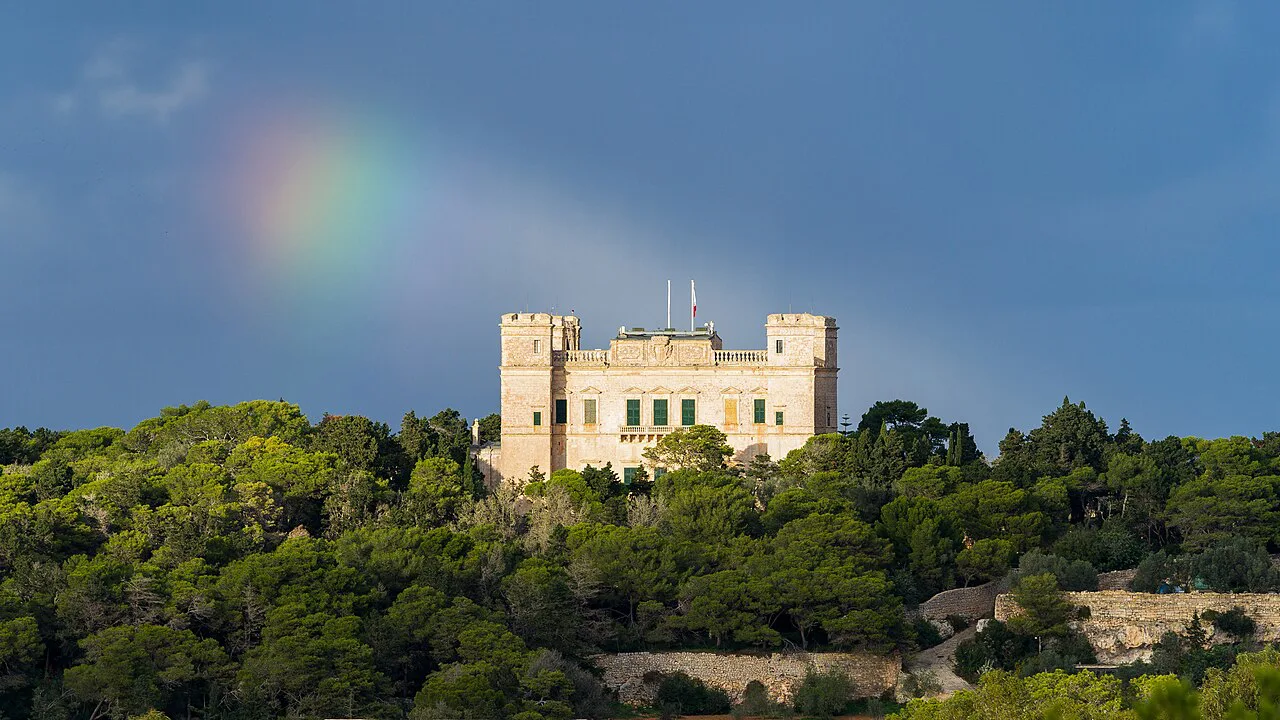 Verdala Palace under a partial rainbow.