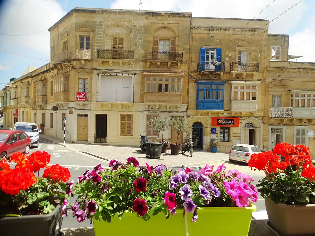 A street in Victoria, Gozo, with flower boxes in the foreground.