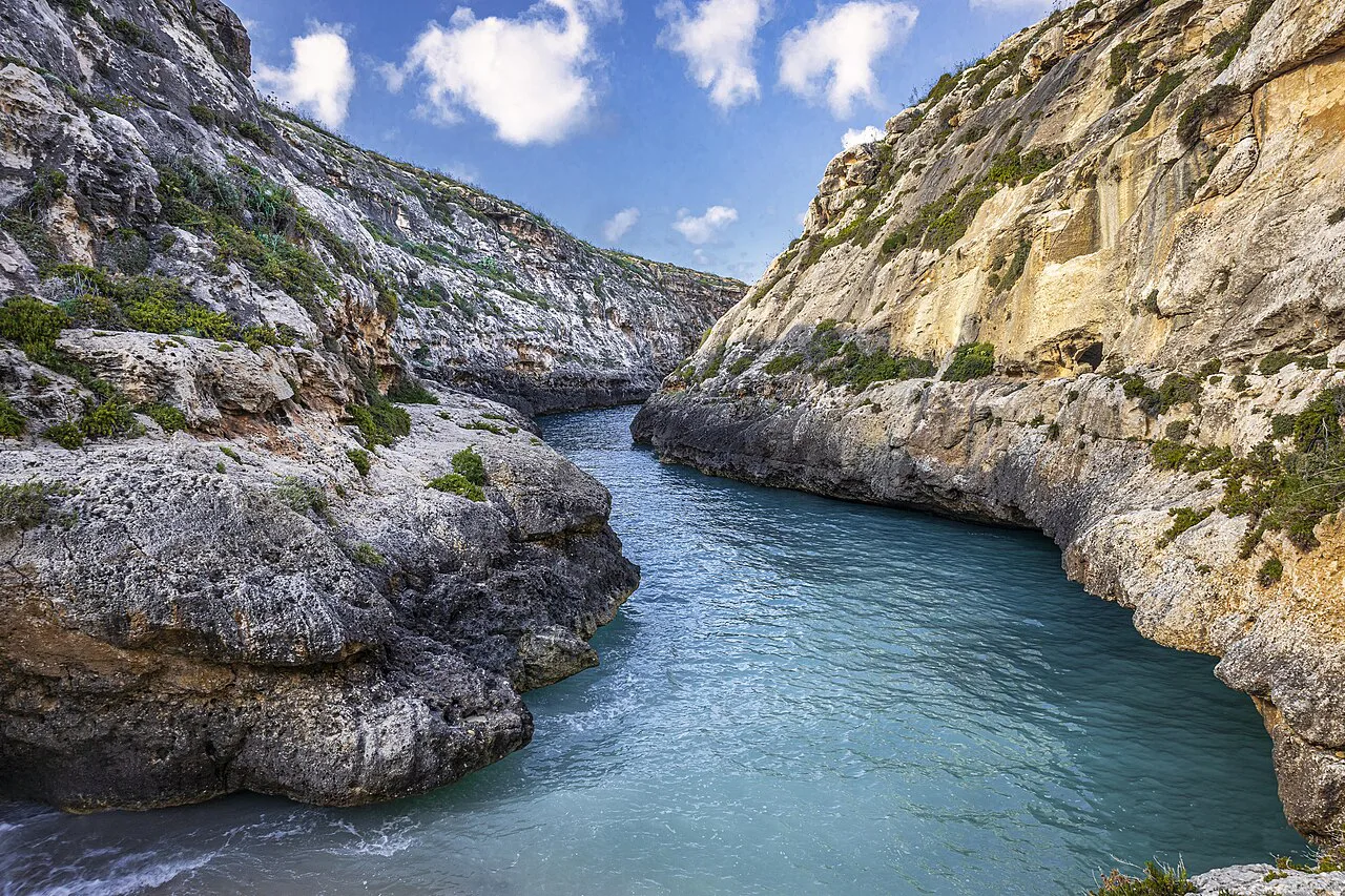 The narrow rocky inlet of Wied il-Għasri in Gozo.