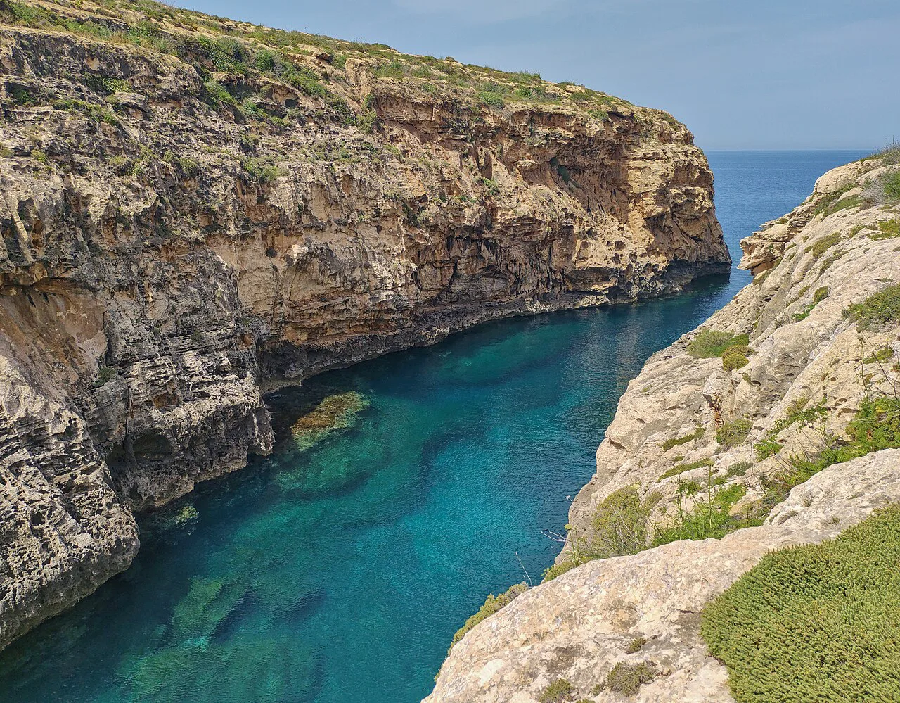 The narrow turquoise inlet of Wied il-Għasri, Gozo.