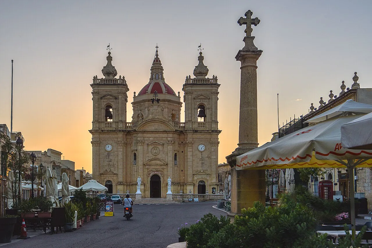 The Basilica of the Nativity of Our Lady in Xagħra at dusk.