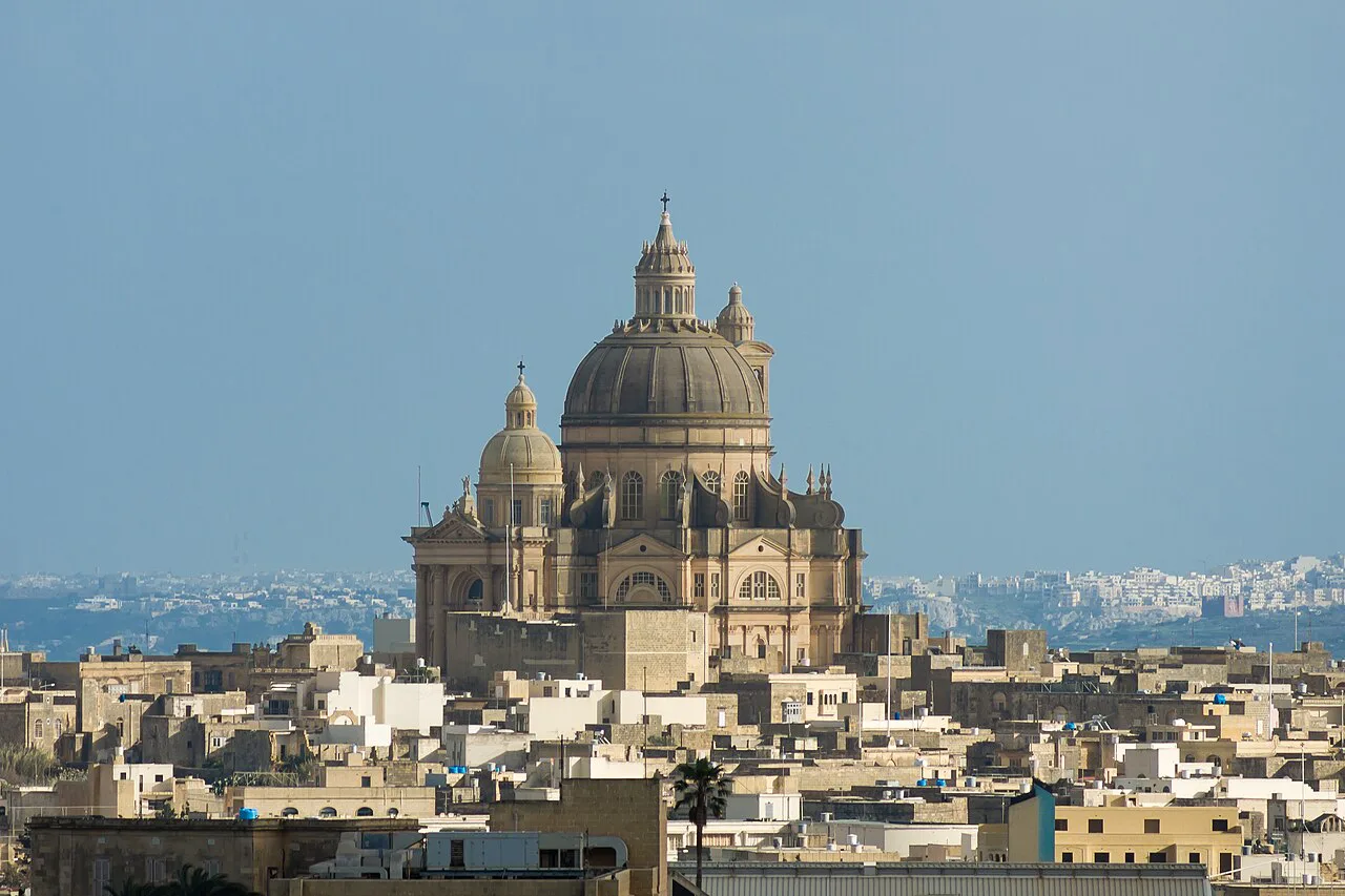 The dome of the Xewkija Rotunda over the rooftops of Gozo.
