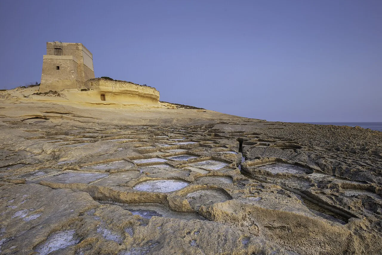 Xlendi Tower on the rocky headland above Xlendi Bay in Gozo.